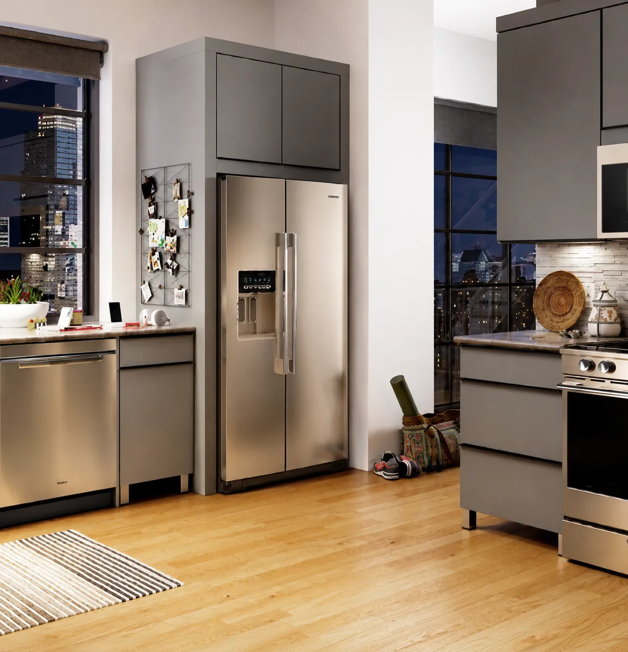 Modern kitchen with a stainless steel side-by-side refrigerator and matching appliances.